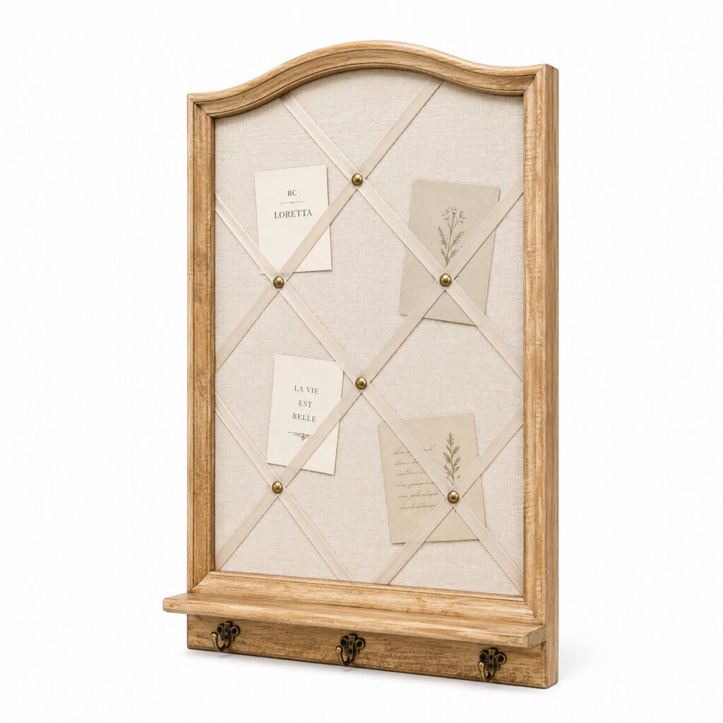 Arched mango wood wall memo board with woven fabric, silk ribbon lattice, brass pins and three small brass hooks on a white background.